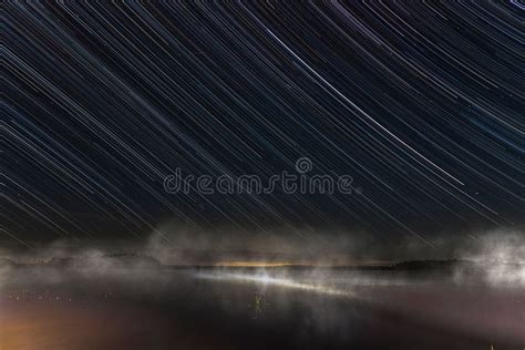 view   lake  beautiful long exposure starry sky stock photo