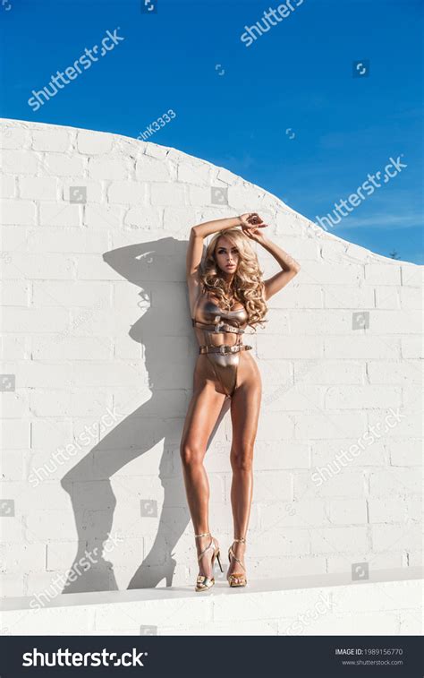 Sexy Blonde Woman Gold Bikini On Stock Photo 1989156770 Shutterstock