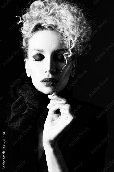 A Beautiful Blonde Girl With An Elegant Hairstyle And Large Breasts Wearing A Bra Scarf And A