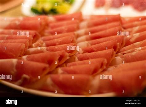 Thin Slices Of Beef Meat Ready To Be Cooked In Hot Pot Popular Chinese Food Dish Stock Photo