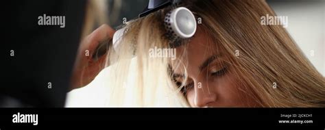 Blonde Woman On Planned Hairdresser Appointment Get Her Hair Done With Hairdryer Stock Photo Alamy