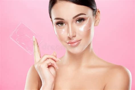 Beautiful Girl With Nude Make Up And Naked Shoulders At Studio Background Invisible Eye Patches