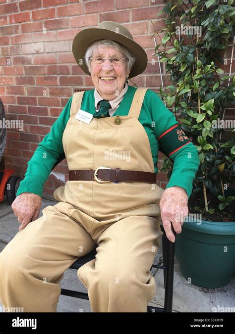 90 Year Old Womens Land Army Veteran Relaxing In Her Garden In Uniform