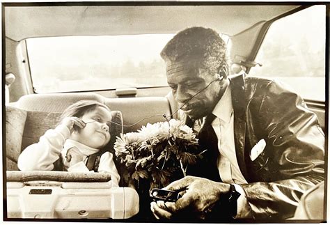 Poppa & Grandbaby, sharing earbuds listening to the Blues… on the way