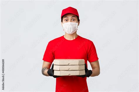 Surprised Asian Delivery Guy Look Embarrassed As Someone Opened Door Naked Holding Pizza As
