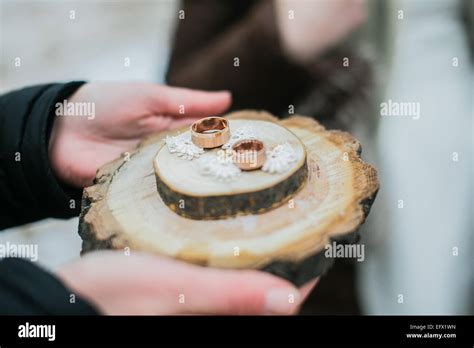 Wedding Rings On A Ring Holder Made Of Wood Slices Stock Photo Alamy