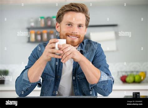 Handsome Man Drinking Coffee At Home Stock Photo Alamy