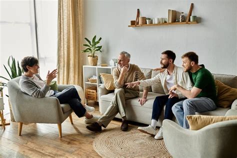 A Gay Couple Sits With Parents Stock Photo Image Of Decor Comfort