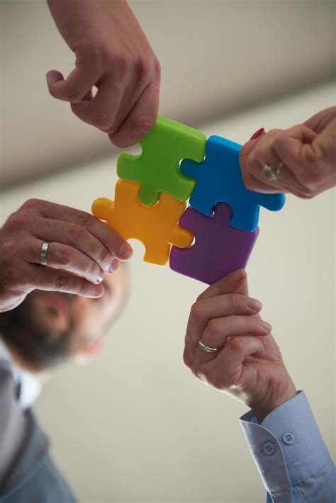 Business People Group Assembling Jigsaw Puzzle Stock Photo At