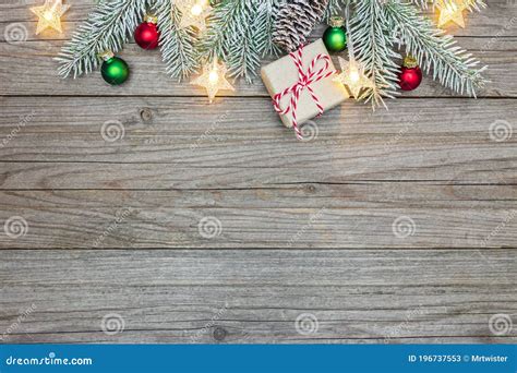 Wooden Background Decorated With Snowy Christmas Tree Branch Glowing