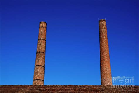 Two Chimneys Against Blue Sky Photograph By Sami Sarkis Fine Art America