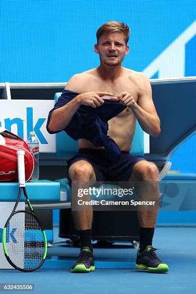 David Goffin of Belgium changes t-shirts in his fourth round match ...