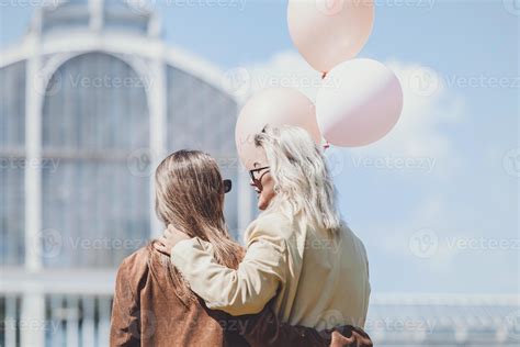 LGBT Lesbian Couple Love Moments Lesbian Couple Holding Balloons In
