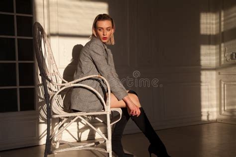 Fashionable Woman Blonde In Lingerie Sits In A White Armchair In Room Stock Image Image Of