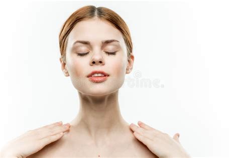 Woman With Closed Eyes Holds Hands Near Face Naked Shoulders Emotions Light Background Stock