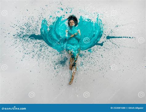 Expressive Woman Lies Naked Elegant On The Floor In Turquoise Blue Color Abstract Painted
