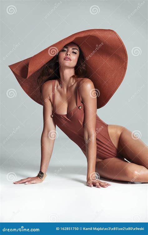 Brunette Model Wearing A Modern Fashionable Hat Isolated Stock Photo Image Of Isolated