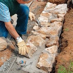 Construire un mur en pierre Tout sur le béton