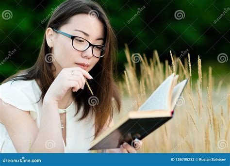 Beautiful Korean Girl Reading Book Outdoors Stock Photo - Image of ...