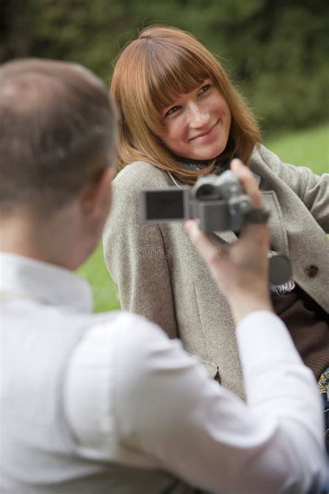 Man with Video Camera Filming Stock Image - Image of filming, smiling ...