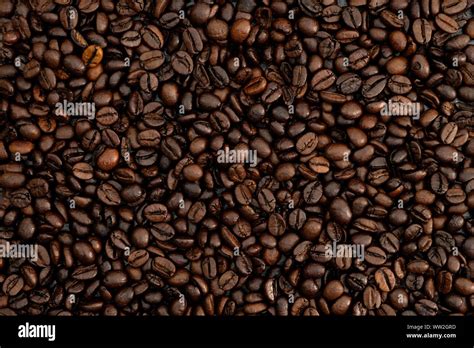 roasted coffee beans background Stock Photo - Alamy