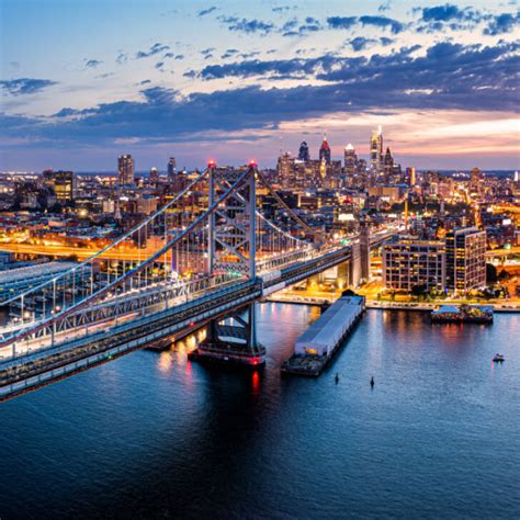 View Of Philadelphia And The Benjamin Franklin Bridge At Dusk From The