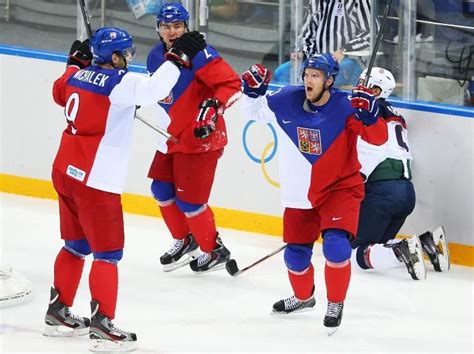 Ales Hemsky (#83) of the Czech Republic (R) is congratulated by ...