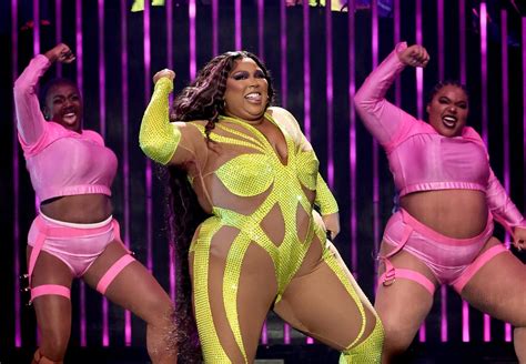 Lizzo Wears Neon Bedazzled Catsuit on Special Tour | POPSUGAR Fashion