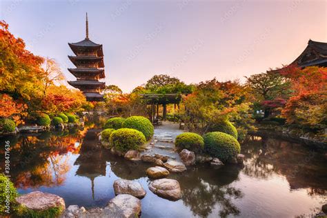 Ancient wooden pagoda Toji temple in autumn garden, Kyoto, Japan. Stock ...