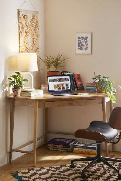 Channel modern rustic vibes and embrace productivity with this desk that fits snuggly in the ...