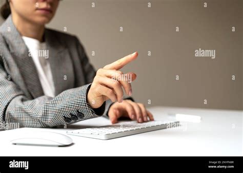 Woman Person Sitting At The Desk Working On Computer Touching Virtual