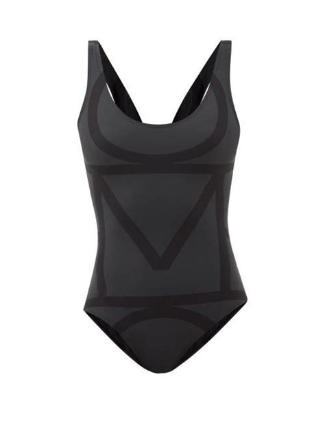 Totême Totêmes Black Swimsuit Is Printed In A Directional Logo Print