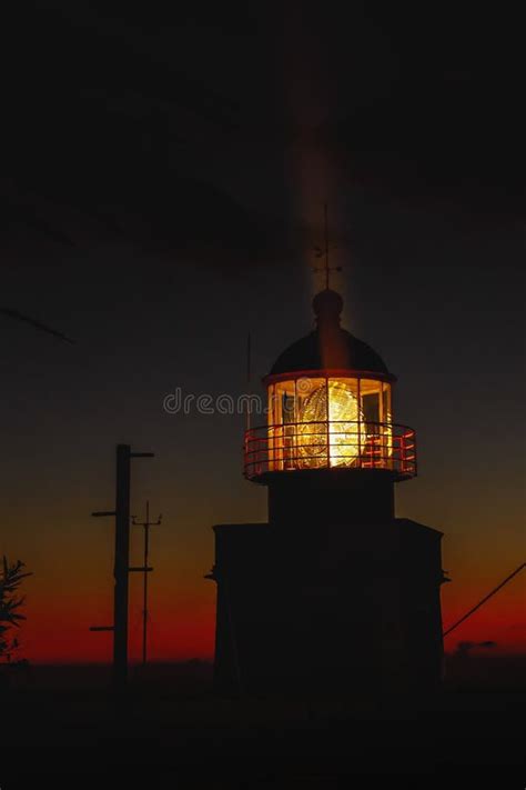 The Classic Lighthouse Silhouette during the Sunset, Dramatic Clouds in ...