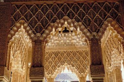 An Intricately Decorated Building With Arches And Pillars