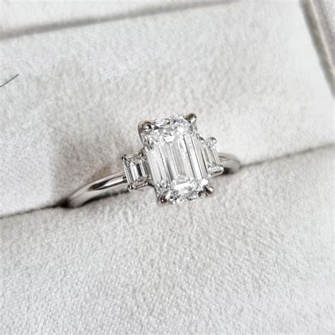 Emerald Cut Trilogy Engagement Rings Online