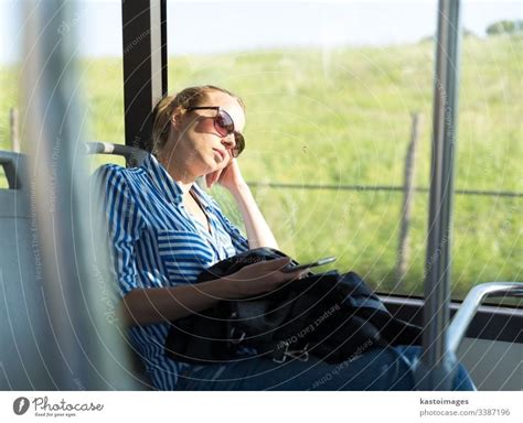 Portrait Of Tired Woman Sleeping On Bus A Royalty Free Stock Photo