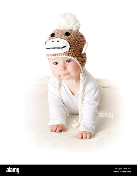 Baby in monkey hat Stock Photo - Alamy