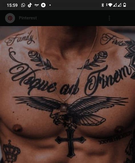 A Shirtless Man With Tattoos On His Chest