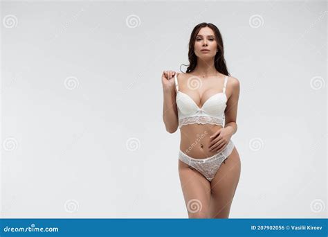 Hot Woman In White Lace Lingerie Looking At Camera Touching Body Stock Photo Image Of Sensual