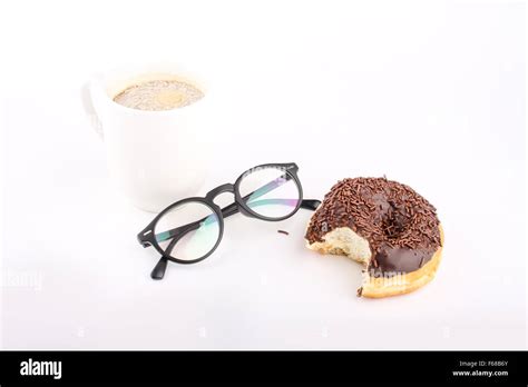 Chocholate Doughnuts Been Eaten Concept With Spectacles And A Hot Drink In The Frame Stock Photo