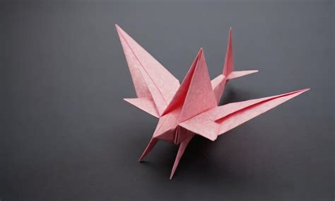 A red origami origami origami made by a student | Premium AI-generated ...