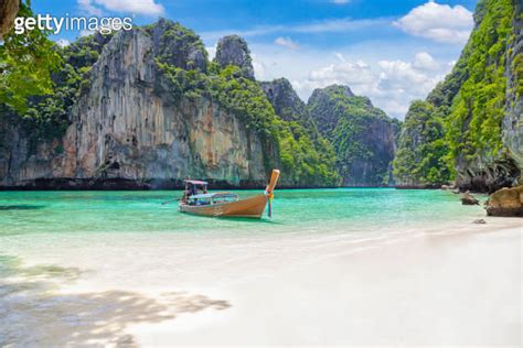 The Thai Traditional Wooden Longtail Boat And Beautiful Beach In Phuket