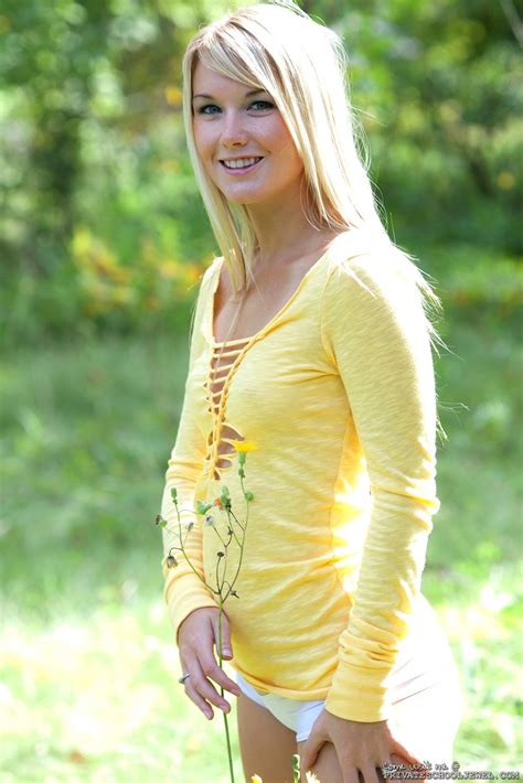 Private Jewel Showing Her Shaved Pussy In A Sunny Field Photos