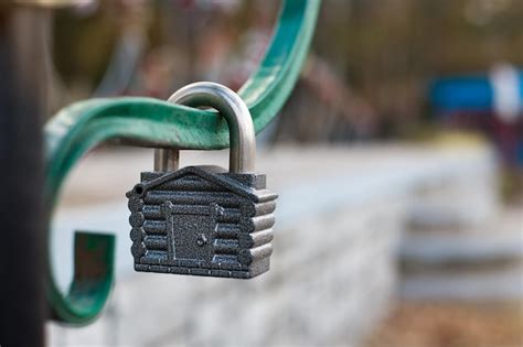 Premium Photo Close Up Of Padlock Hanging On Metal