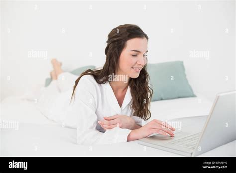 Relaxed Casual Brunette Using Laptop In Bed Stock Photo Alamy
