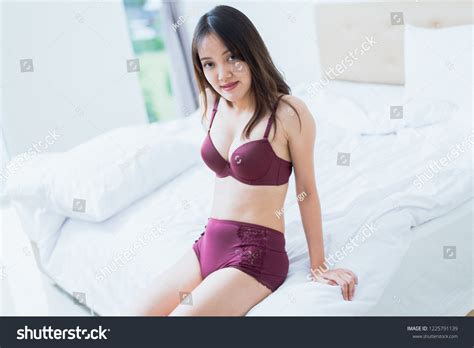 Sexy Asian Woman Lingerie Sitting On Foto De Stock