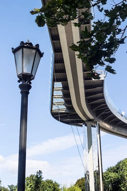 Premium Photo | Modern urban architecture bridge curved against the sky