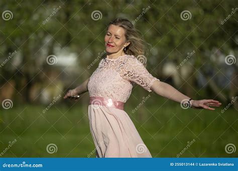 A Beautiful Elderly Blonde Woman In A Romantic Dress Opened Stock Photo Image Of Happy Active