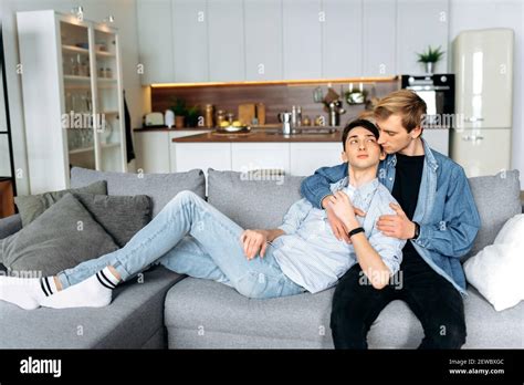 Homosexual Guys Relaxing On The Couch Caucasian Loving Gay Couple