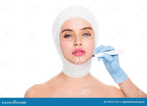 View Of Plastic Surgeon In Latex Glove Holding Marker Pen Near Naked Woman With Marks On Face
